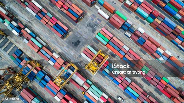 Container Ship In Import Export And Business Logistics By Crane Trade Port Shipping Cargo To Harbor Aerial View From Drone International Transportation Business Logistics Concept Stock Photo - Download Image Now