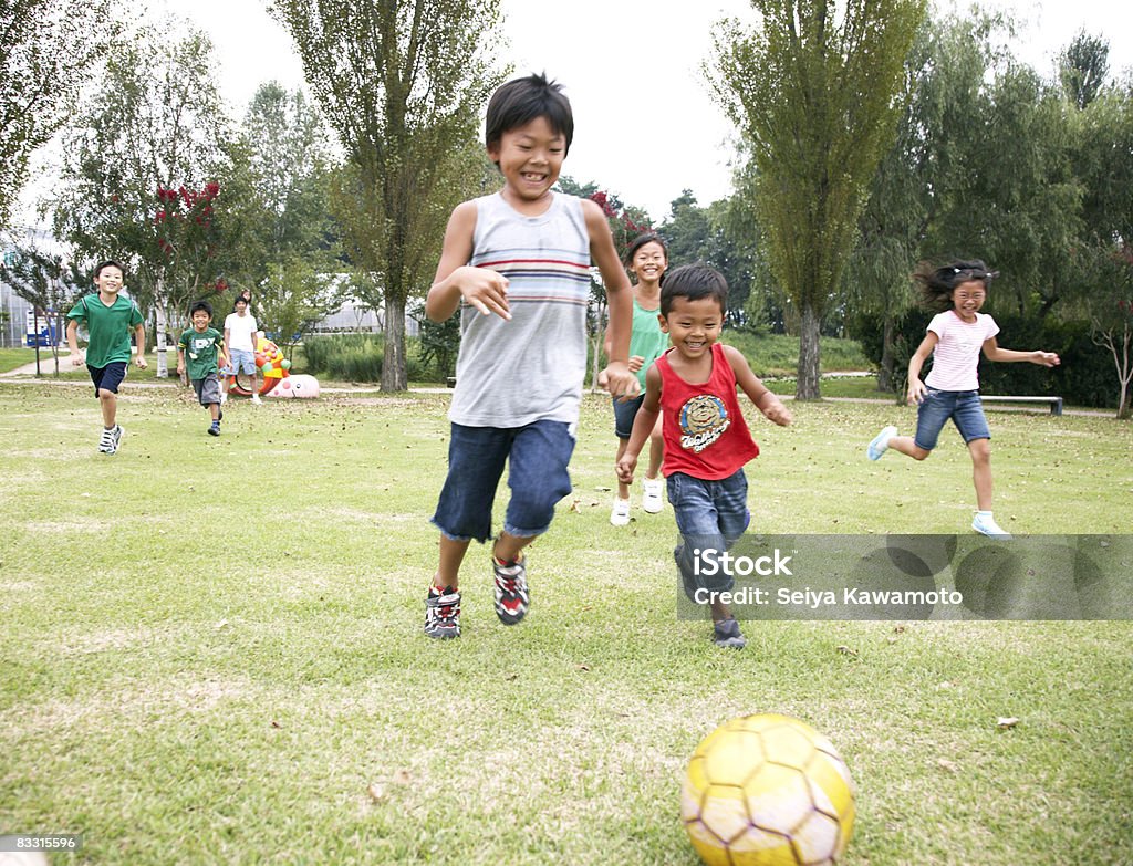 Japanese children playing soccer  Child Stock Photo