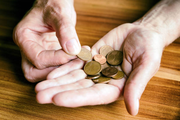 Coins in hand Euro coins in hand of senior. cent sign photos stock pictures, royalty-free photos & images