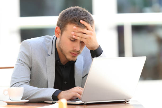 istock Worried executive on line in a coffee shop 833160654