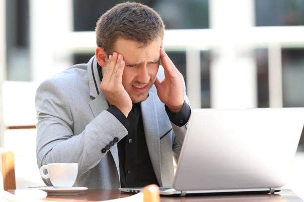 istock Executive suffering head ache in a coffee shop 833161020