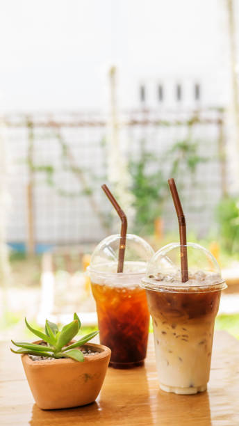 istock iced latte and americano coffee on a wooden table. 833161576