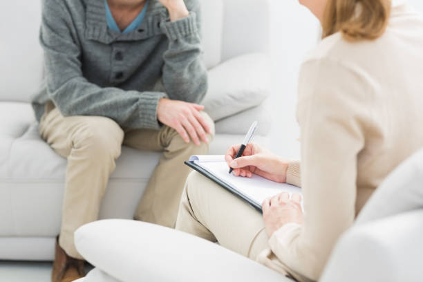 istock Young man in meeting with a psychologist 833162200