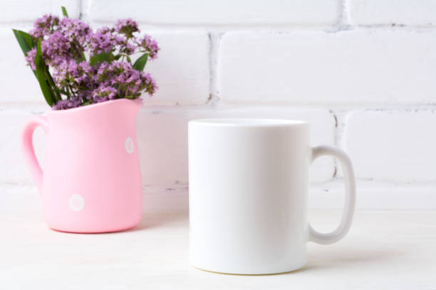 istock White coffee mug mockup with purple flowers in polka dot pink pitcher 833171212