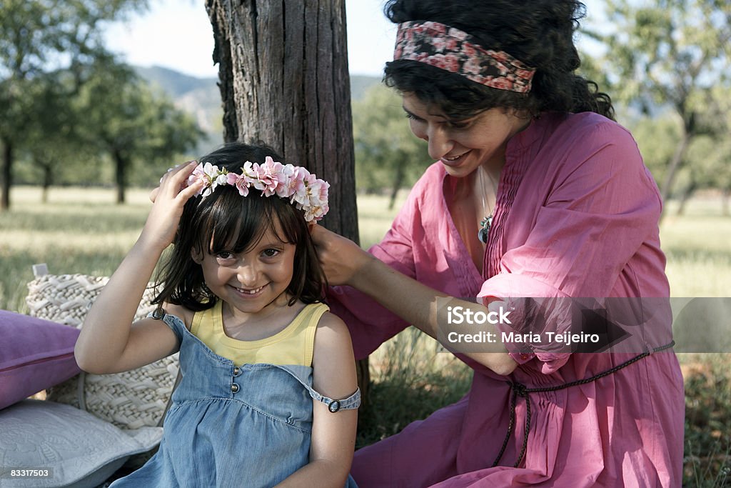 Mother Putting Flowers In Girls Hair Stock Photo - Download Image Now -  25-29 Years, 6-7 Years, Bangs - Hair - iStock