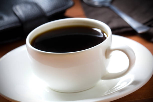 istock Coffee espresso black cup wooden background 833175892