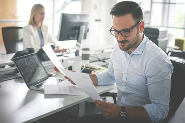 istock Business people working. Business man reading document . 833211970