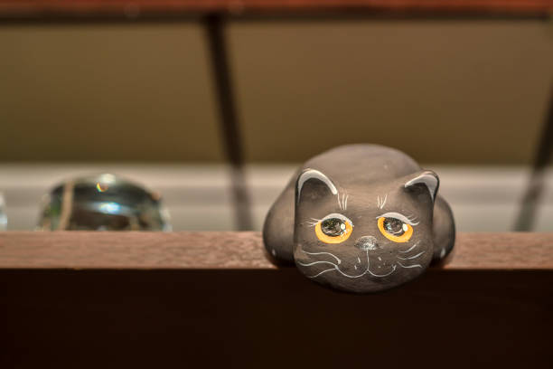 istock Small figurine of black ct on shelf 833212634