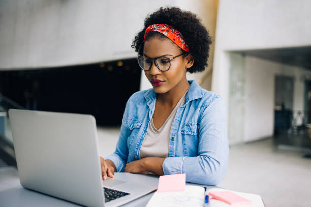 istock Young African female entrepreneur hard at work on a laptop 833216982