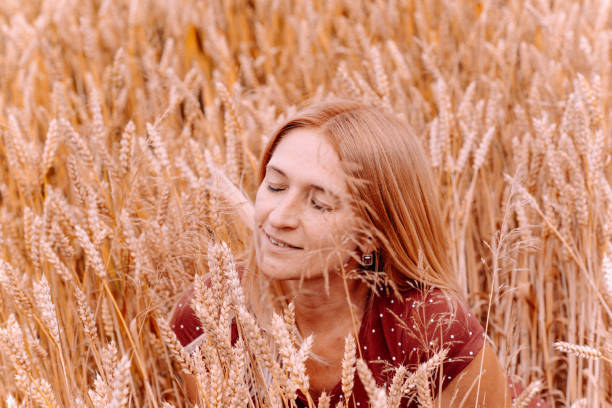 istock Woman in a yellow wheat field 833220866