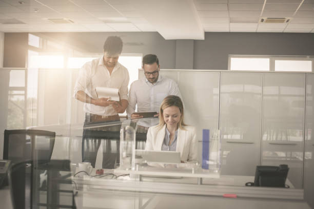 istock Business people working in office together. 833226136