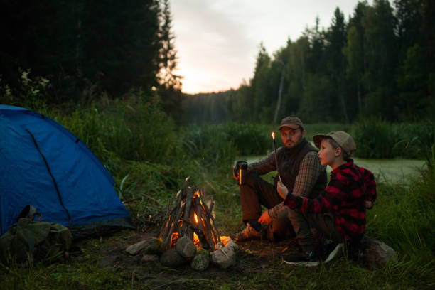 istock Father and son camping together 833226618