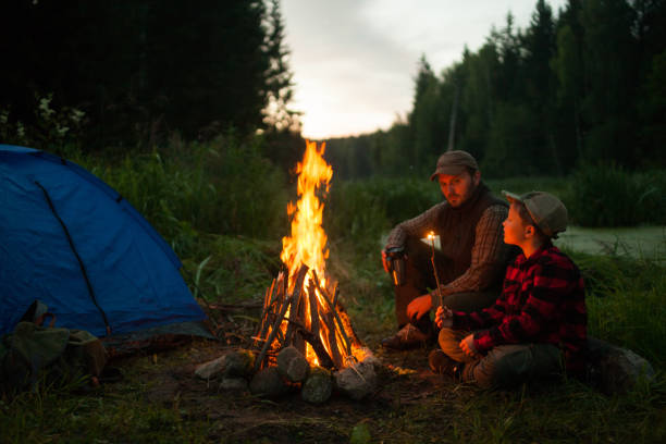 istock Father and son camping together 833226652