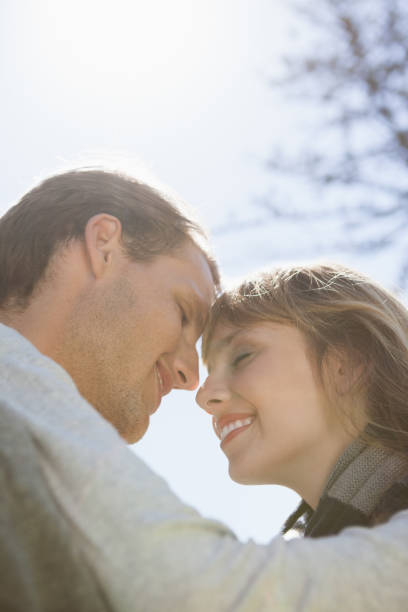 istock Cute couple hugging in the park 833234396