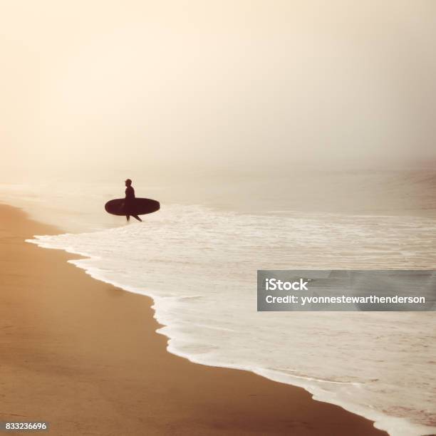 Silhouette Of Surfer On Foggy Beach Stock Photo - Download Image Now - Beach, Breaking Wave, Fog