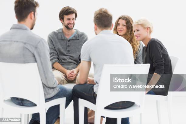 Group Therapy In Session Sitting In A Circle Stock Photo - Download Image Now - Focus Group, Group Of People, Mental Health
