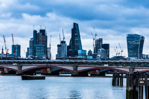 istock Modern London Urban Skyline and River Thames at Dusk 833253248