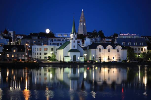 istock Rising moon over Reykjavik churches 833260384