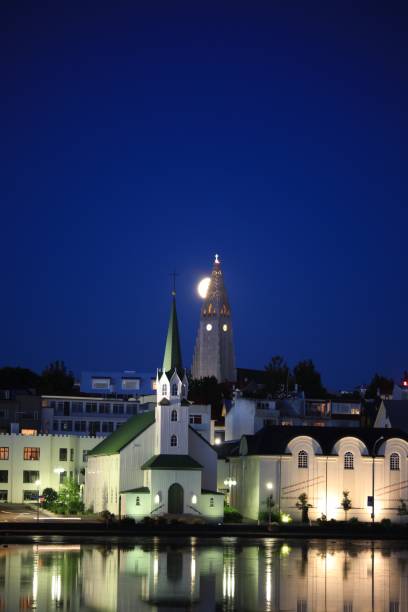 istock Rising moon over Reykjavik churches 833260398