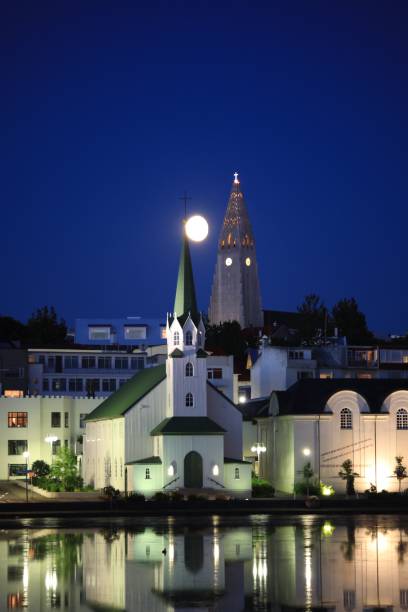 istock Rising moon over Reykjavik churches 833260404