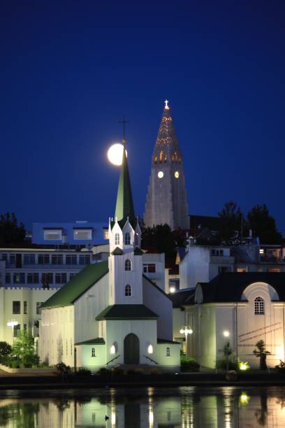 istock Rising moon over Reykjavik churches 833260412