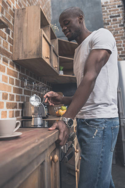 istock African american man preparing coffee 833269306