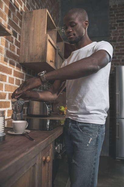 istock African american man preparing coffee 833271812
