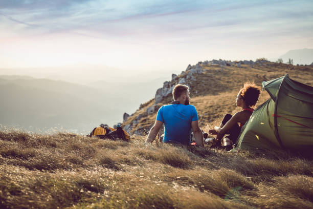 istock Young Couple Camping on Top of Hill 833287682