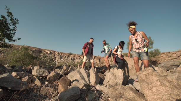 istock People hiking in rocks and having break 833289782