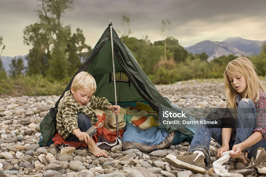 Brother and sister playing in small tent Brother and sister sharing tent  Getting Dressed Stock Photo