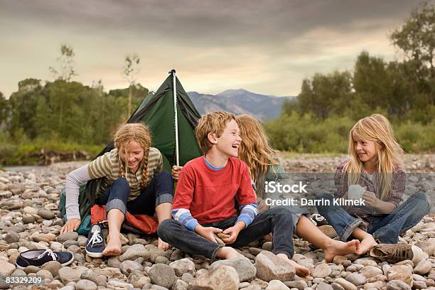 Brother And Sisters Playing In Small Tent Stock Photo - Download Image Now - Child, Camping, Vacations