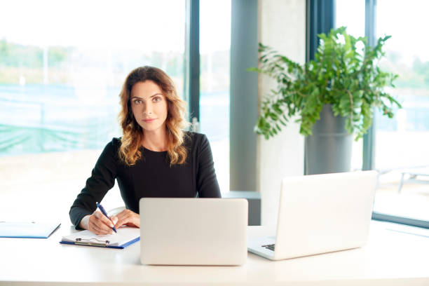 istock Managing her business at the office 833292398