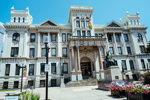 Front facade of the Office of the Municipal Council, City Hall, in Jersey City, USA, from Grove Street. Jersey City's population is increasing, and like its neighbour Hoboken, Jersey City is changing rapidly into an attractive place to live for New York commuters.