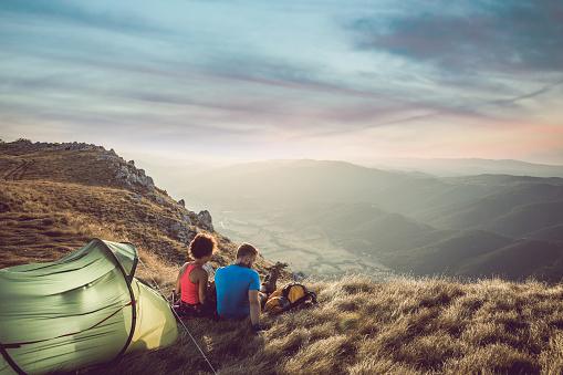 Young Couple Camping on Top of Hill