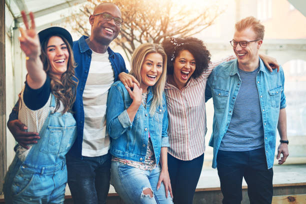 istock Embracing group of having fun multiethnic friends 833295746