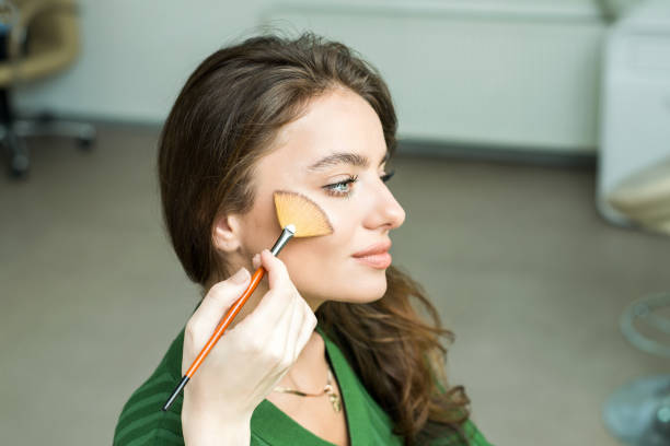 istock Woman applying cosmetic 833296280