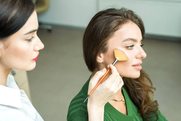 istock Woman applying cosmetic 833296332