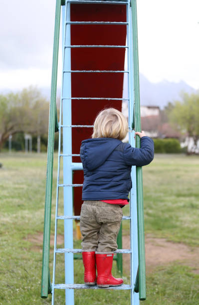istock A boy playing in the local playpark 833299000