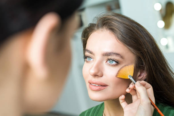 istock Woman applying cosmetic 833306392