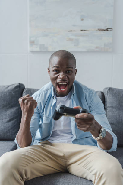 istock African american man playing with joystick 833322330