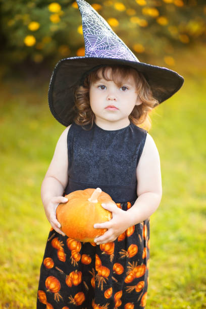 istock Adorable little witch portrait 833322774
