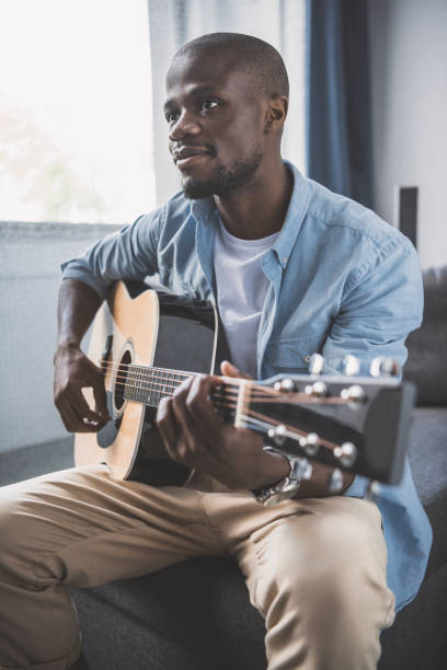 istock African american man with guitar 833334960