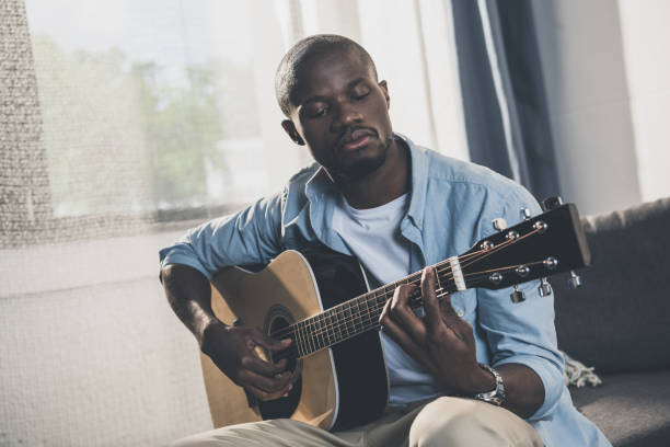 istock African american man with guitar 833335722