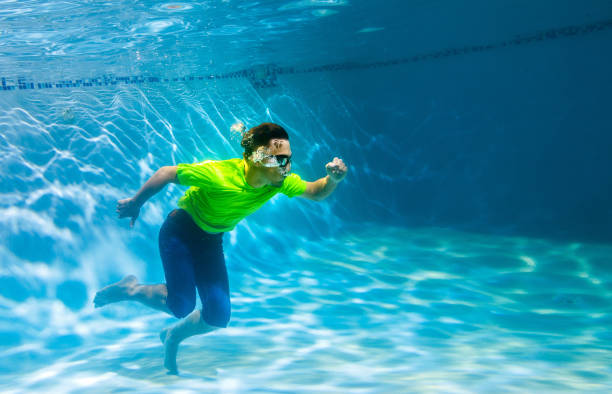 istock Teen underwater running 833335964