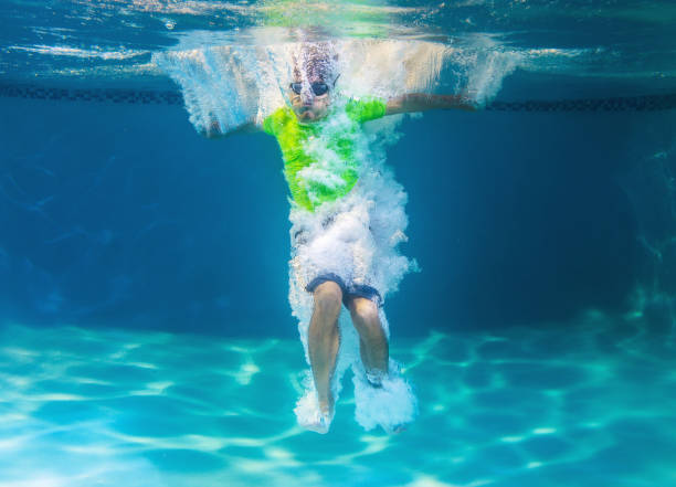 istock Teen jumping on a pool 833336096