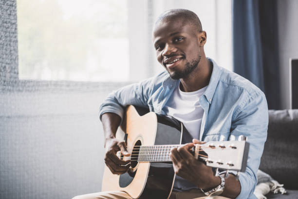 istock African american man with guitar 833336122