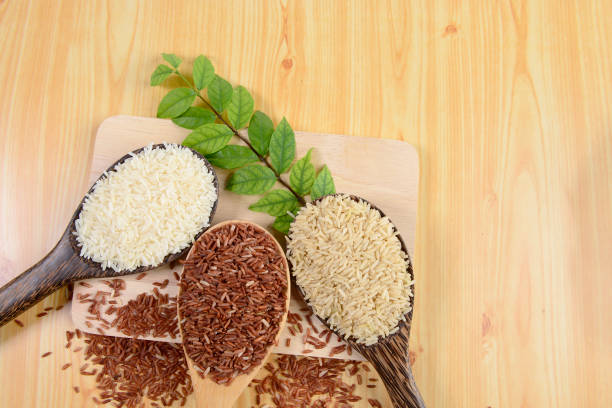 istock Set of rice collection on ladle on wood texture background. 833357036