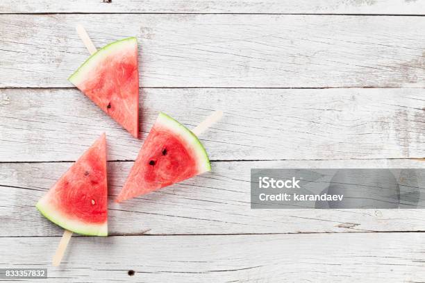 Fresh Watermelon Slices Stock Photo - Download Image Now - Sticky, Watermelon, Blue