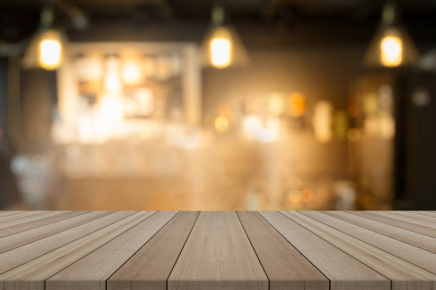 istock Empty wood table top on blurred background form coffee shop,for montage your products 833361714