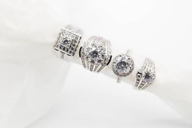istock Diamond wedding rings on the white. selective focus 833369184